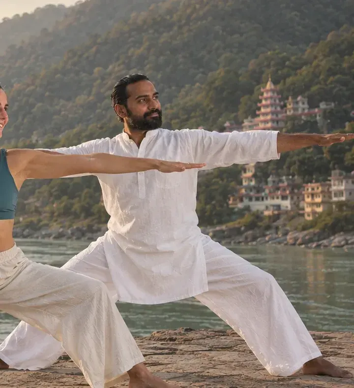 Abhishek in Warrior II by the river.